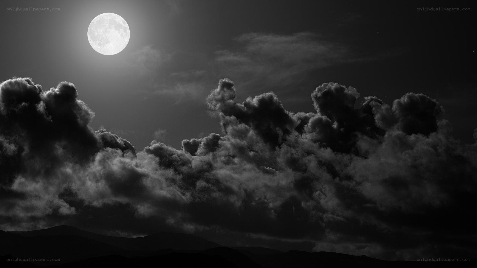 Moonlit clouds over mountains
