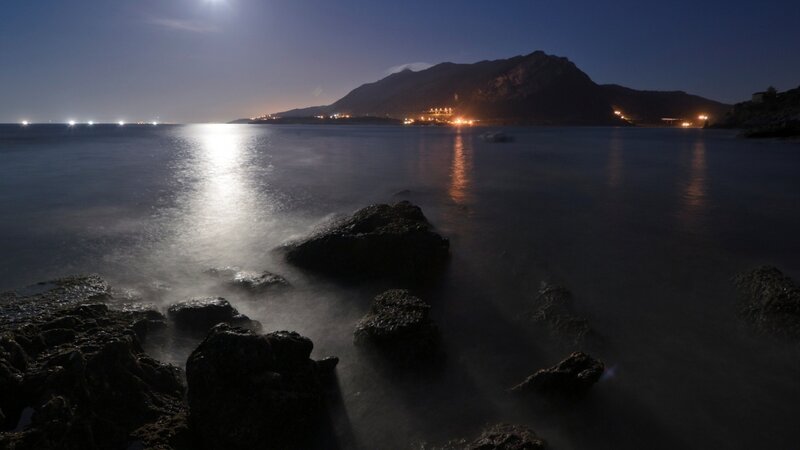 Moonlit coast at night