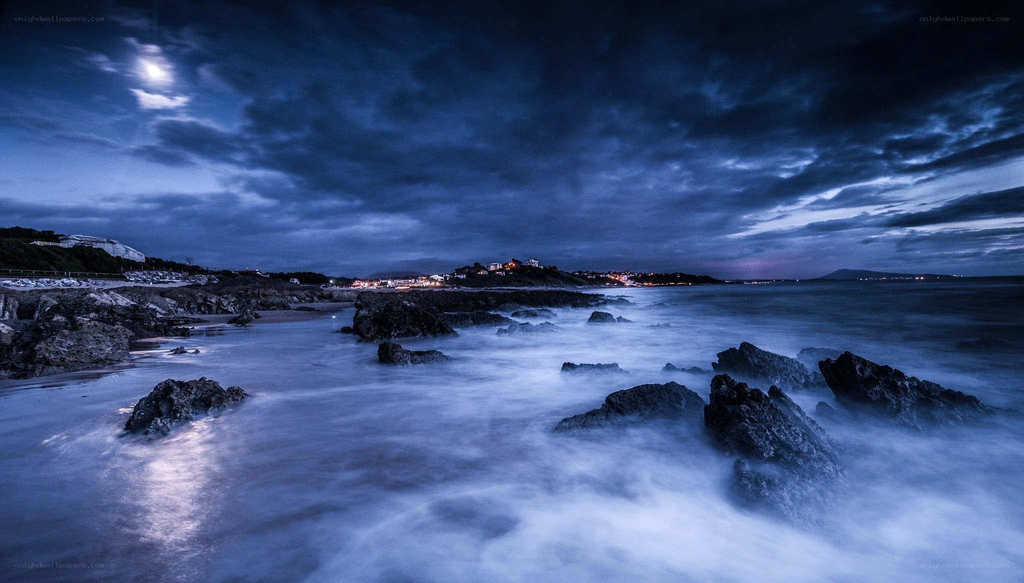 Moonlit coastal night scene