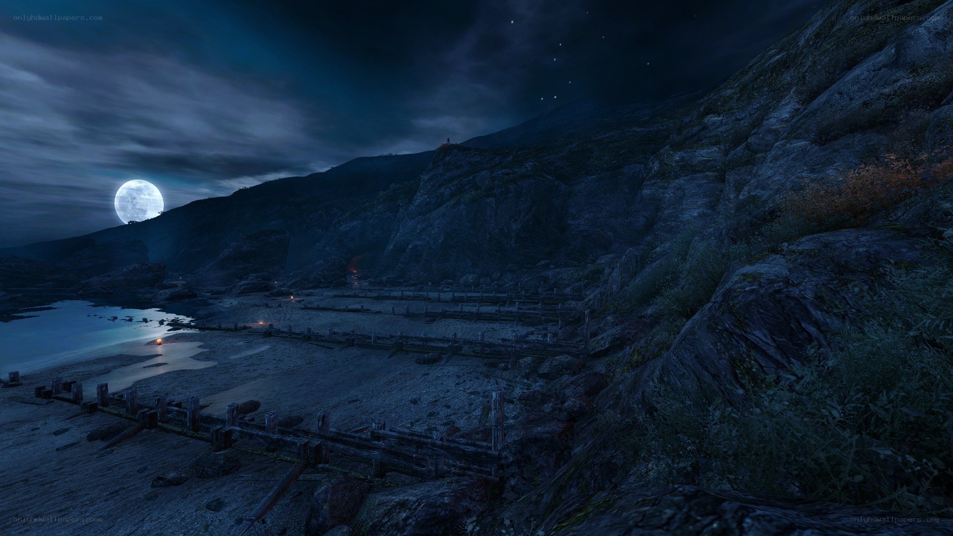 Moonlit coastal ruins at night