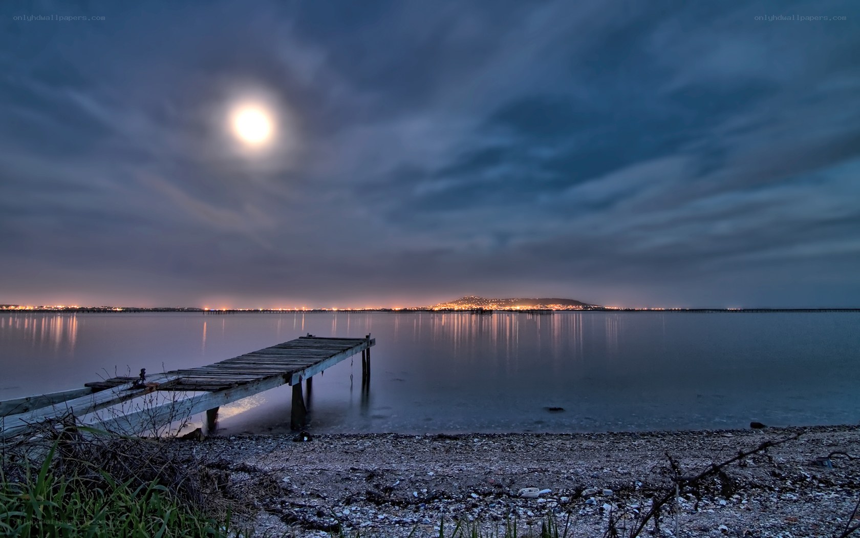 Moonlit dock at night