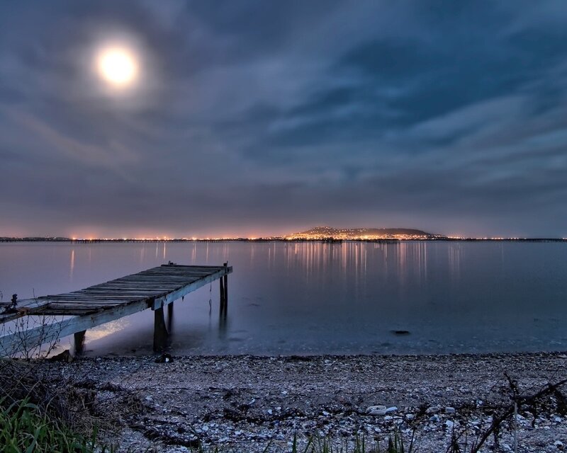Moonlit dock at night
