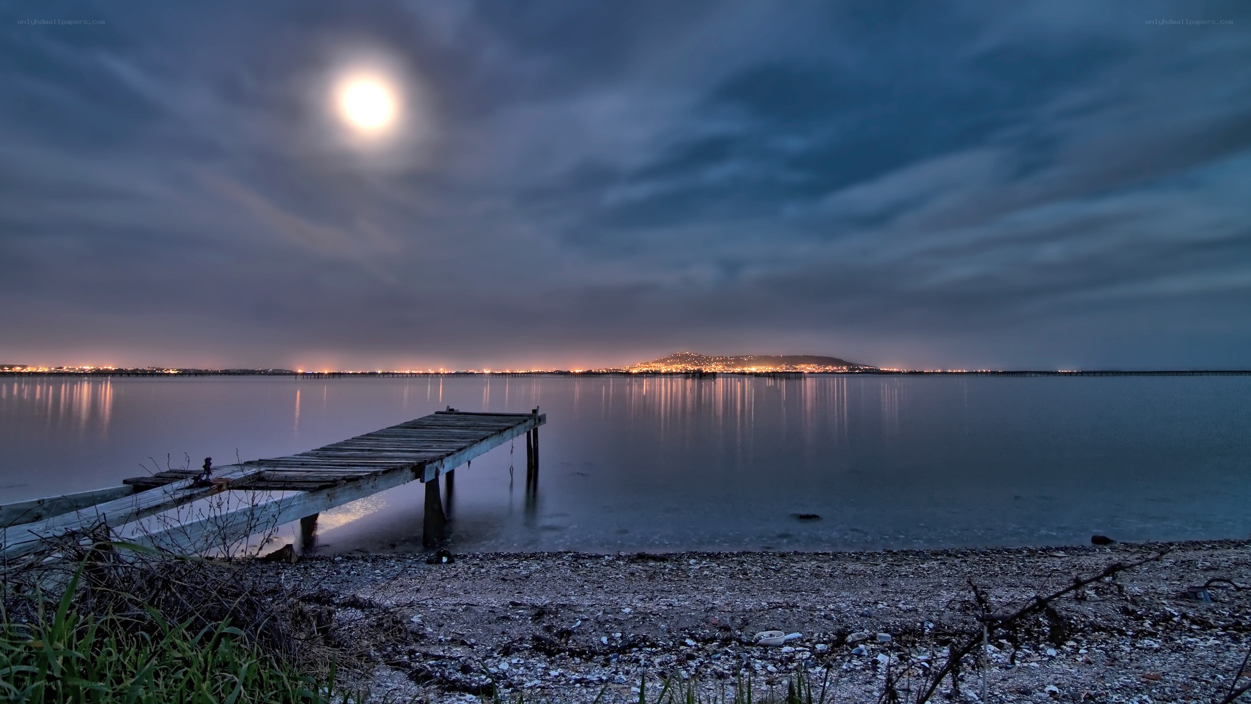 Moonlit dock at night