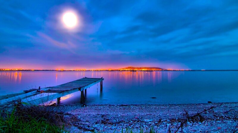 Moonlit dock at twilight
