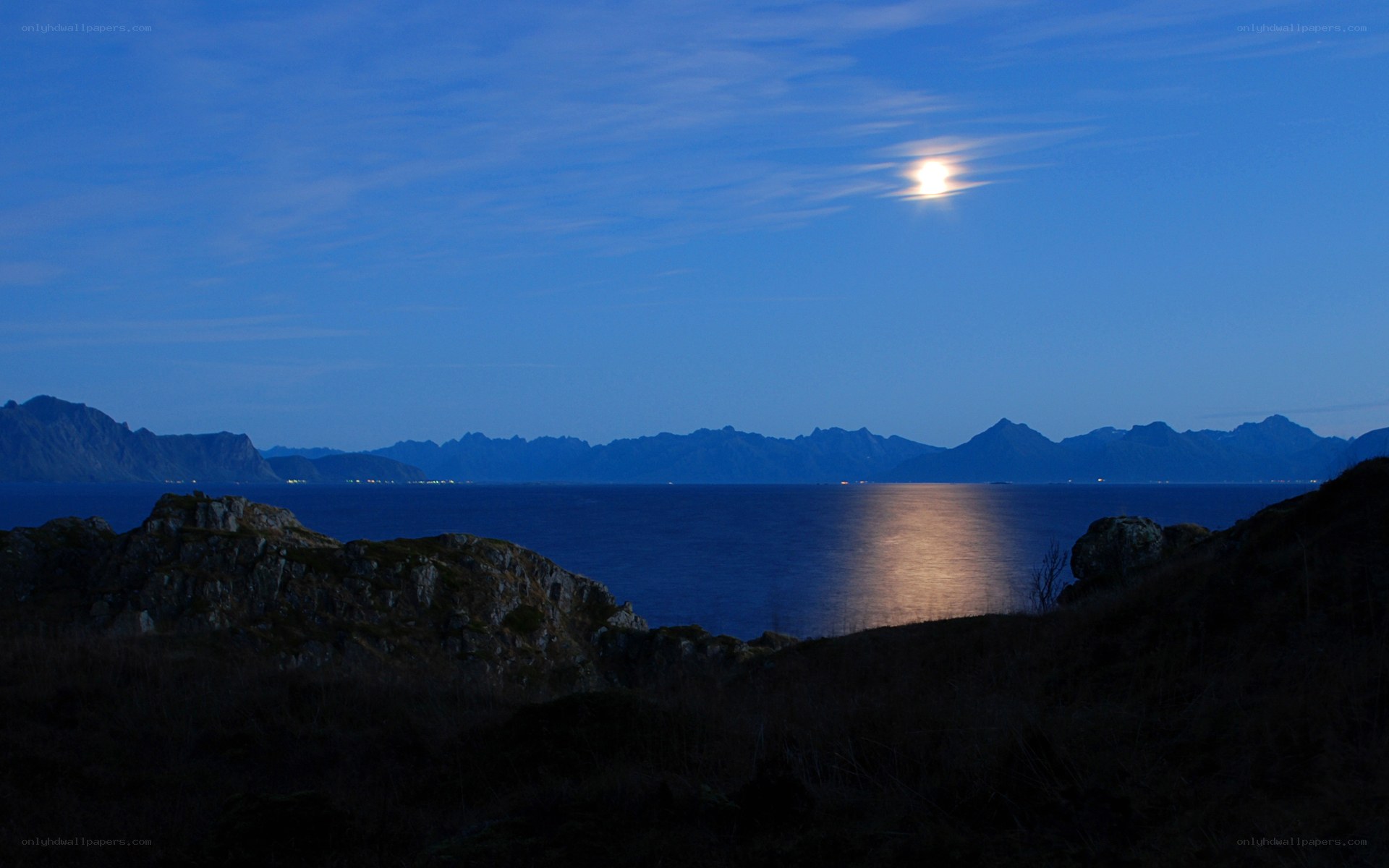 Moonlit fjord at dusk