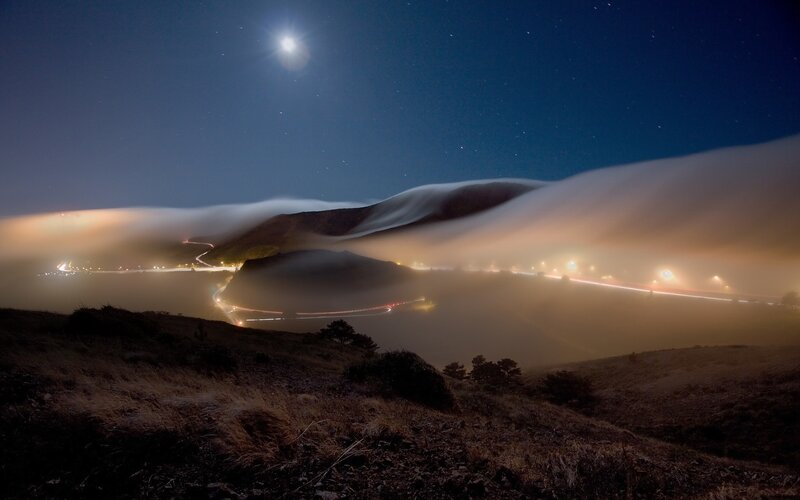 Moonlit Fog Over Coastal Road