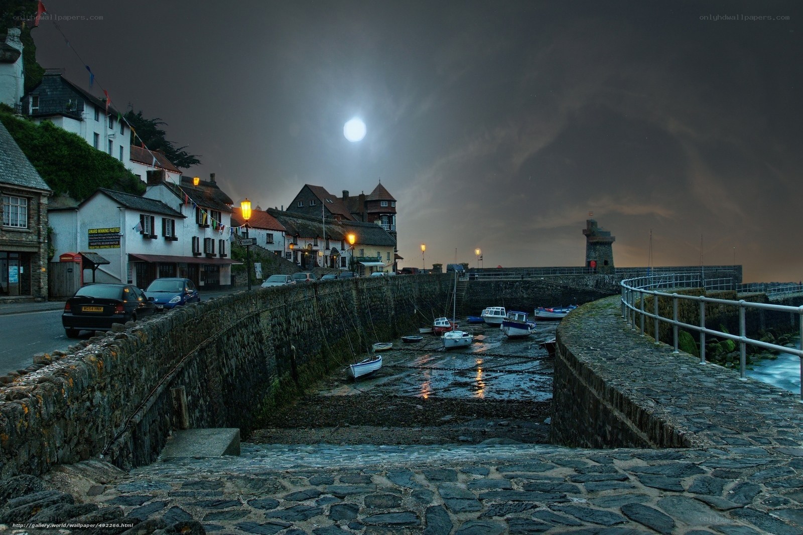 Moonlit harbor at night