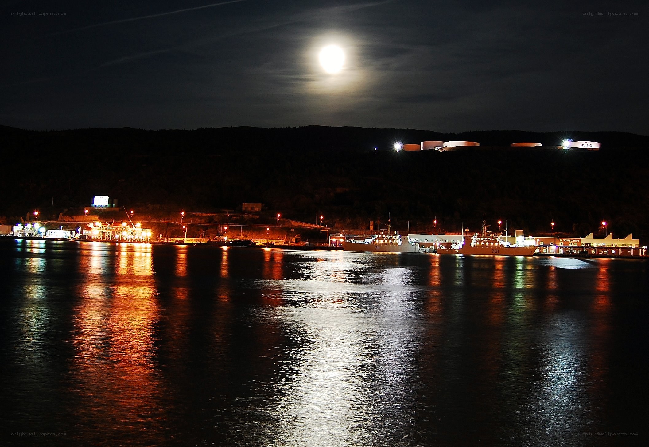 Moonlit harbor at night