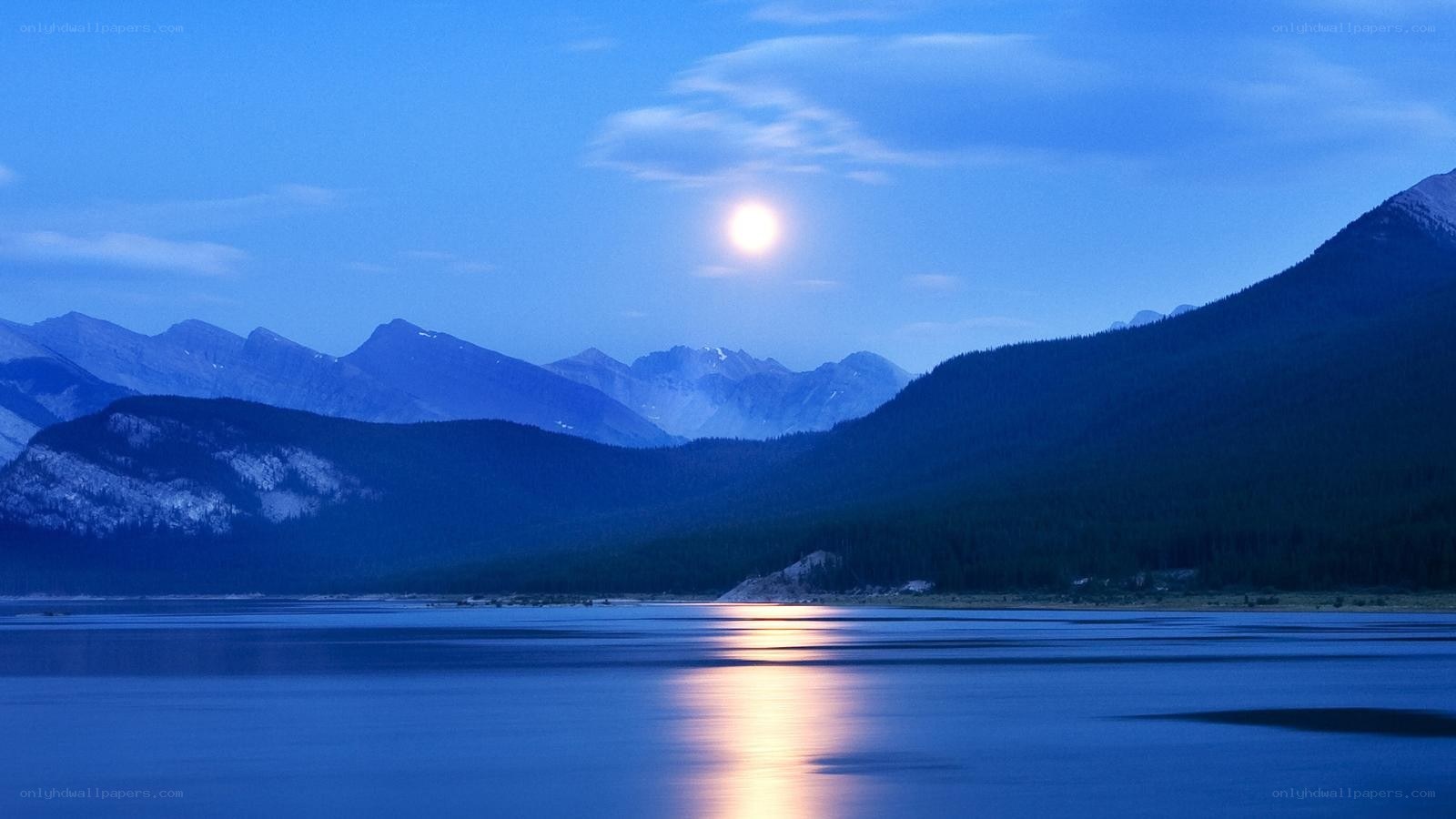 Moonlit lake and mountains