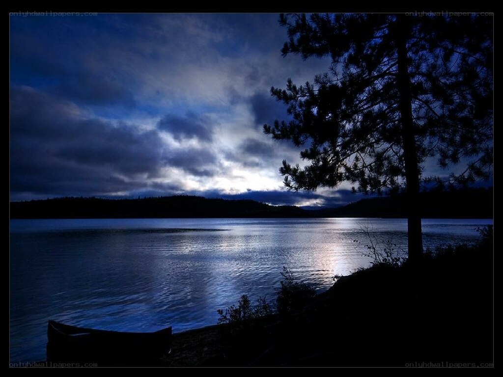 Moonlit lake at dusk