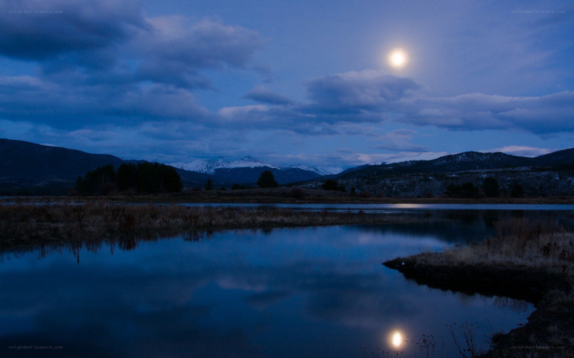 Moonlit lake at dusk