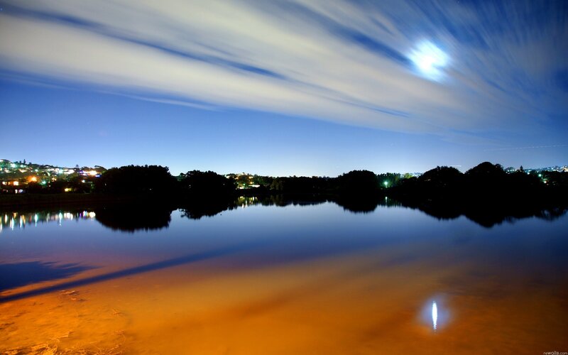 Moonlit lake at night