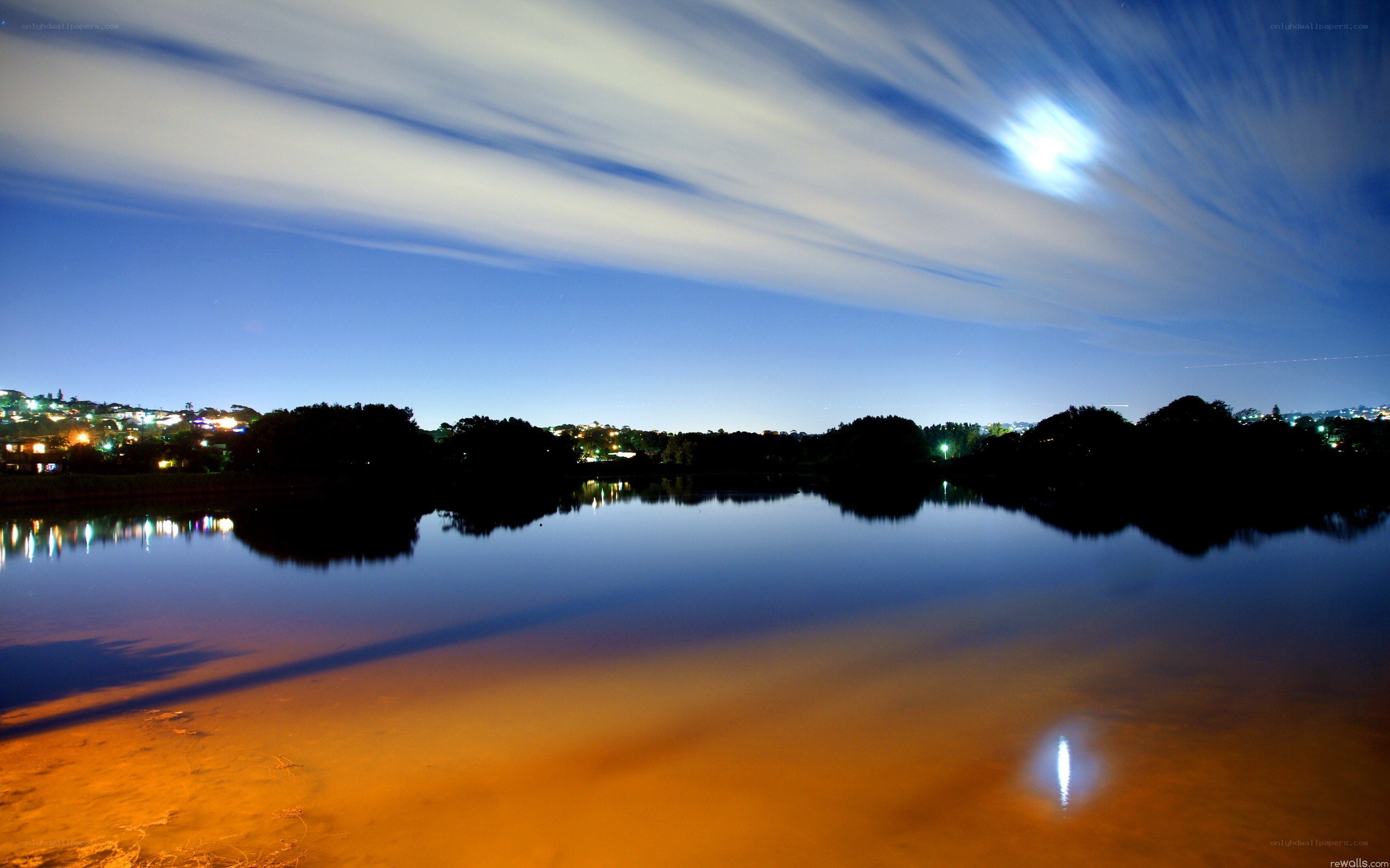 Moonlit lake at night