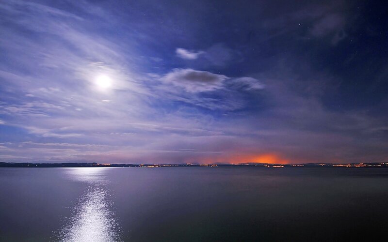 Moonlit lake at night