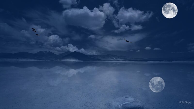 Moonlit lake with mountains