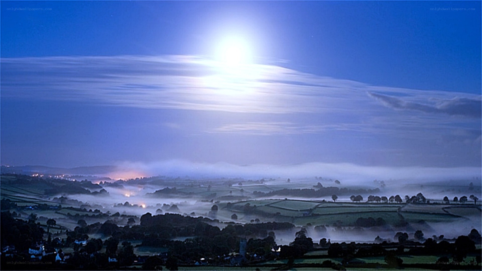 Moonlit misty valley landscape