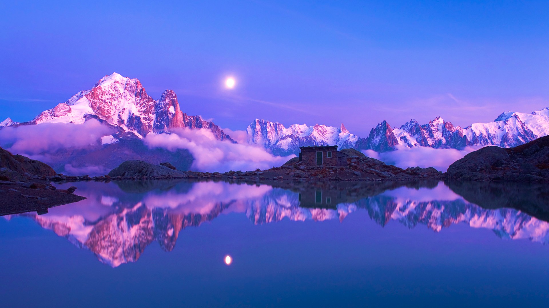 Moonlit mountain lake reflection