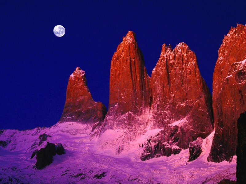 Moonlit mountain peaks at night