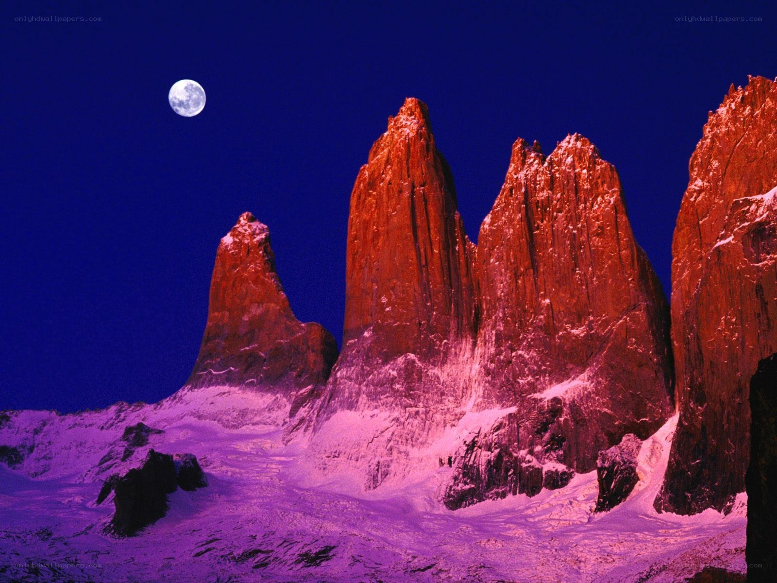 Moonlit mountain peaks at night