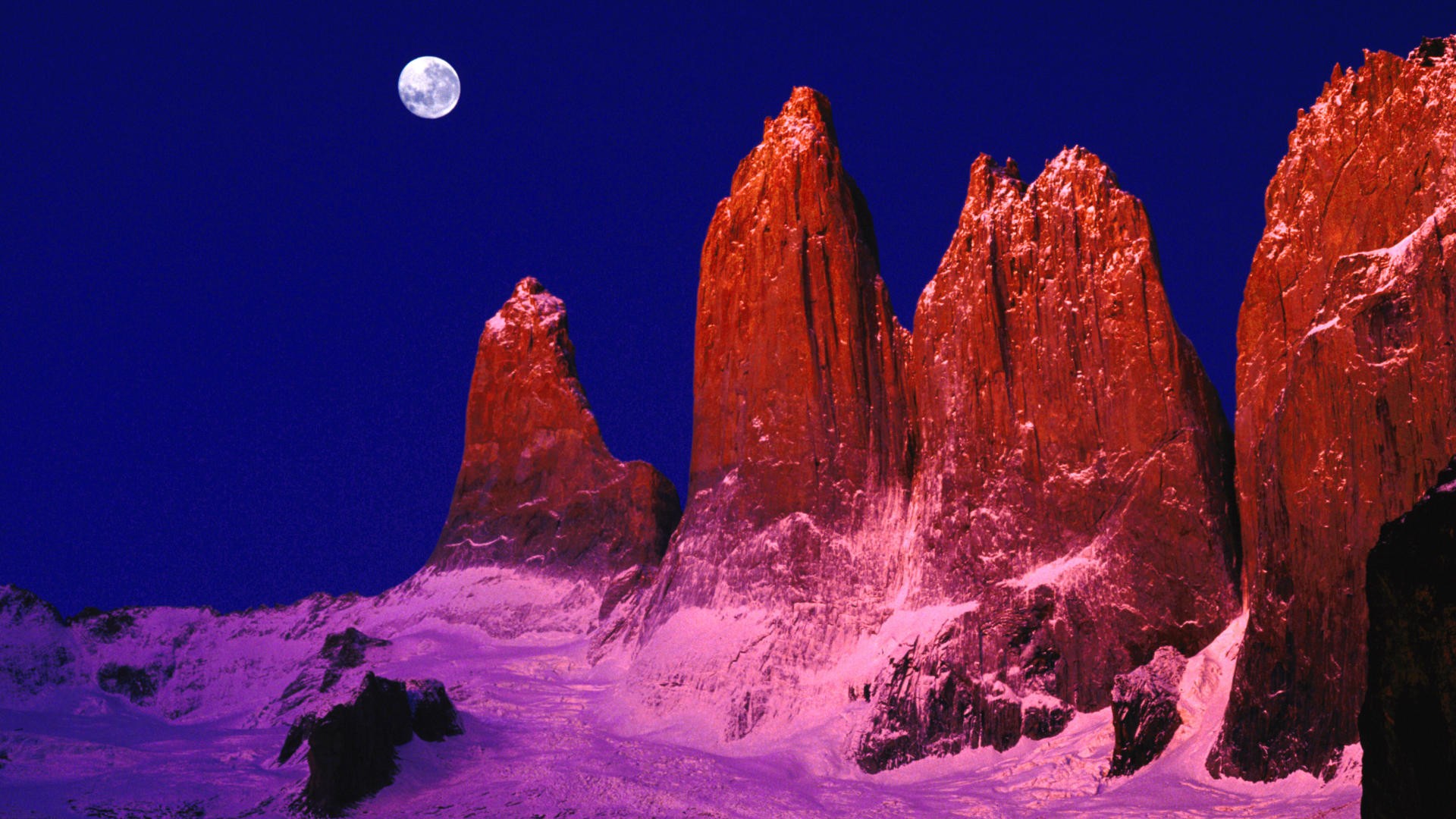 Moonlit mountain peaks at night