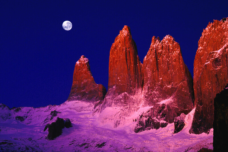 Moonlit mountain peaks at night