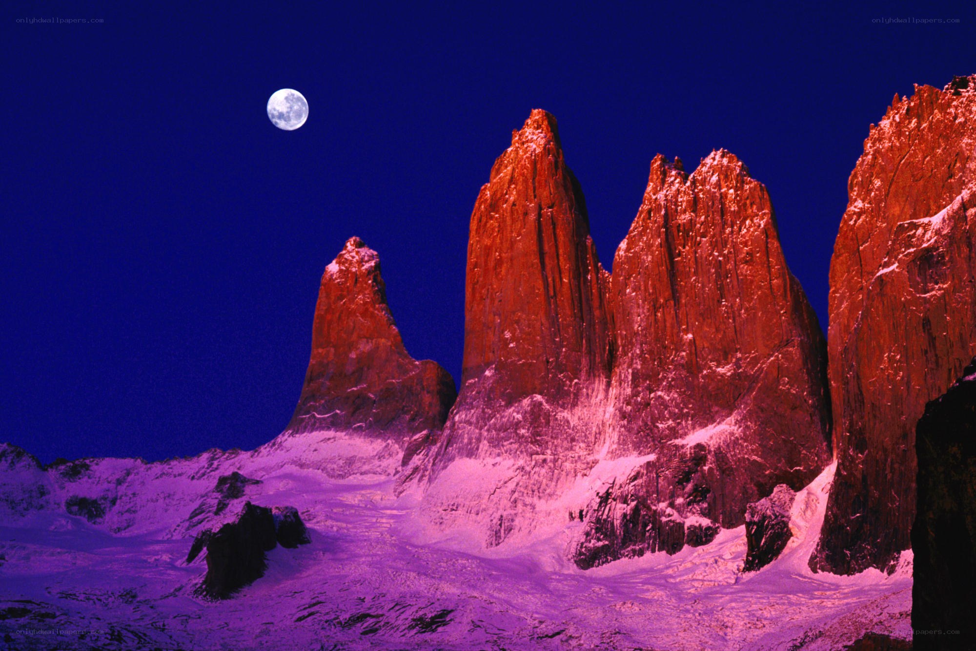 Moonlit mountain peaks at night