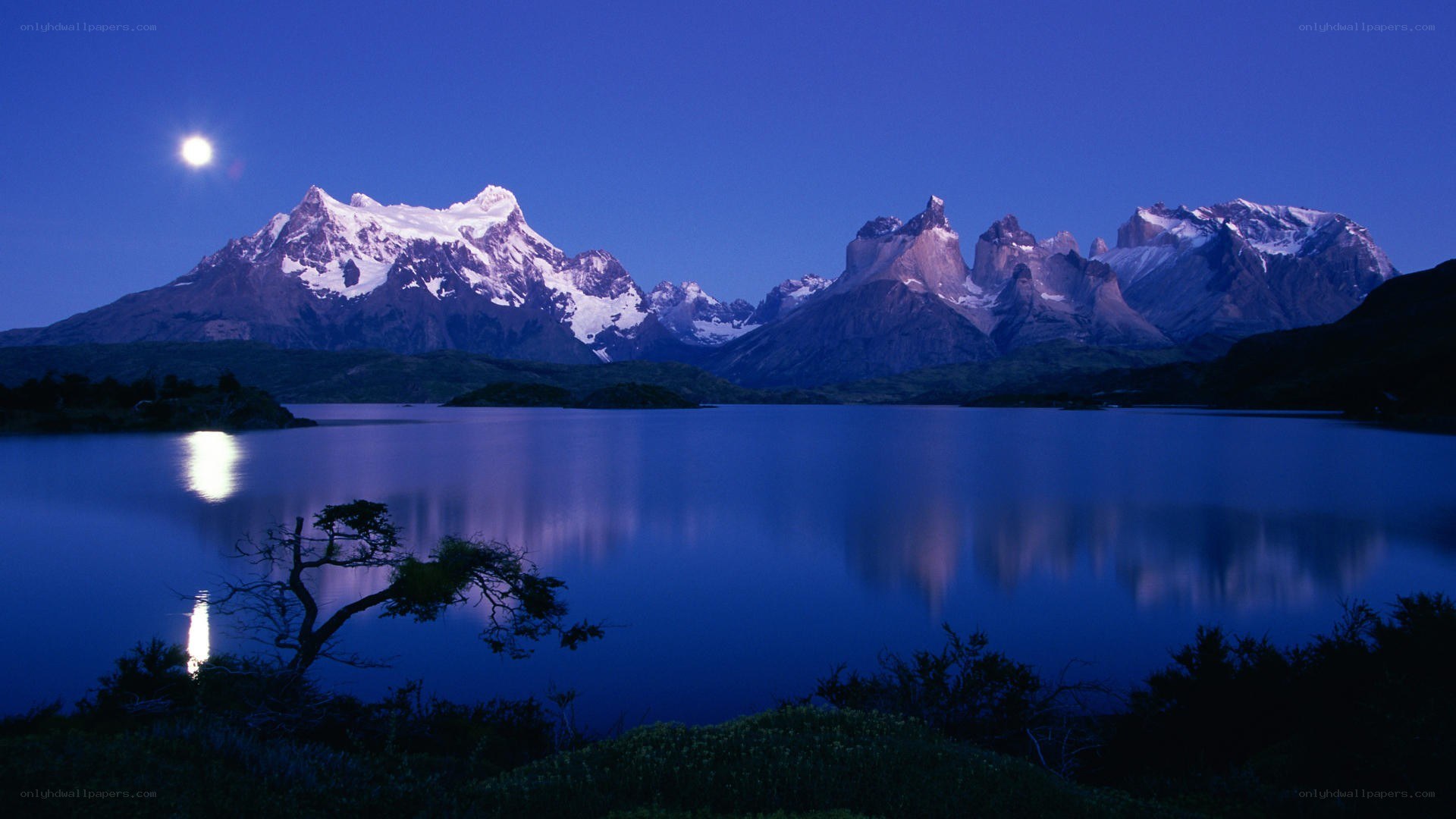 Moonlit mountains and lake