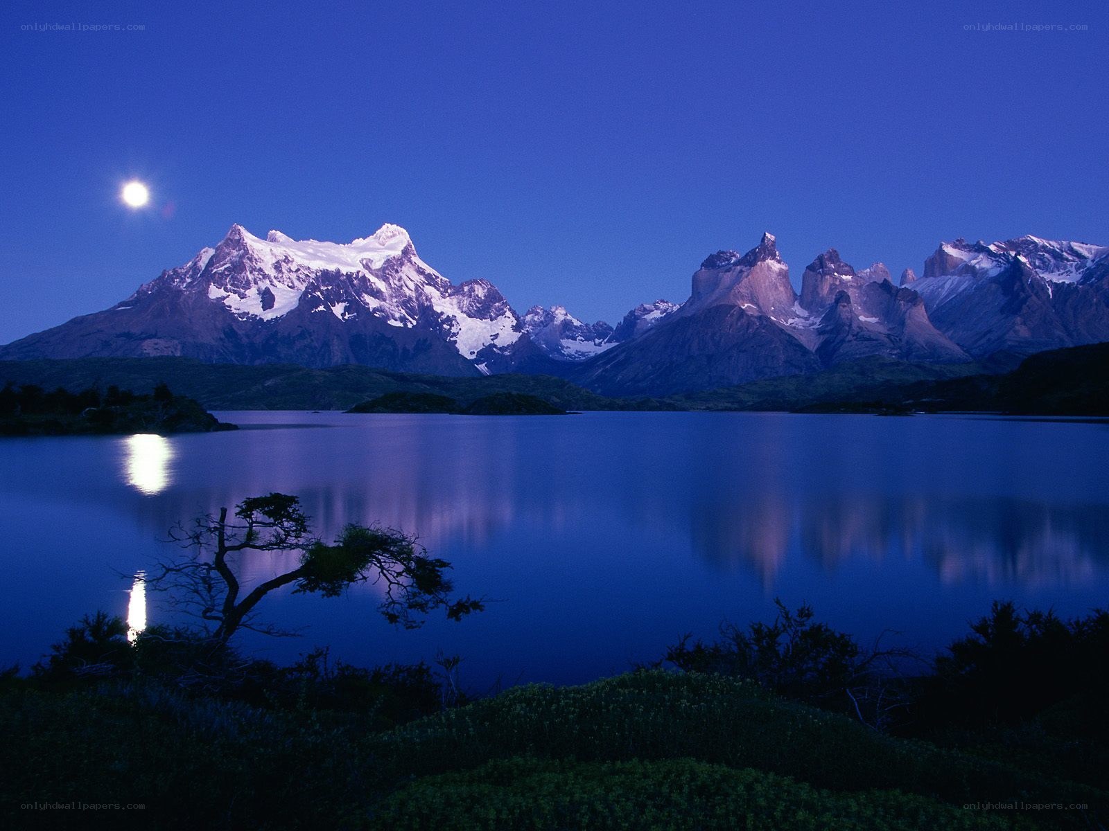 Moonlit mountains and lake