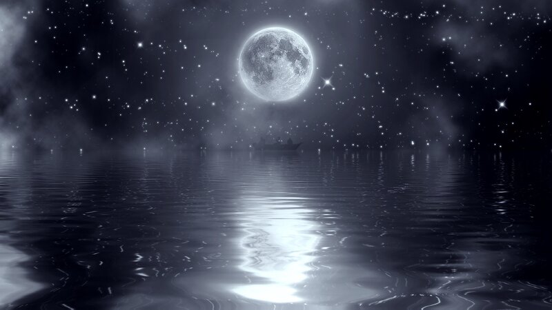Moonlit night over calm water
