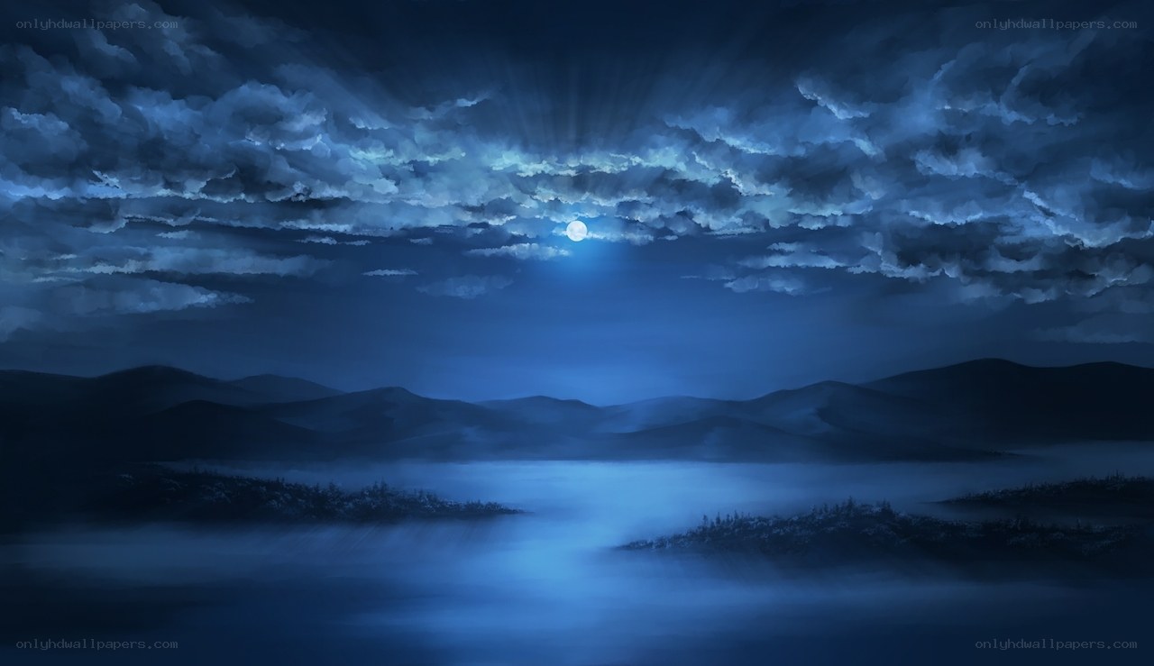 Moonlit night over misty mountains