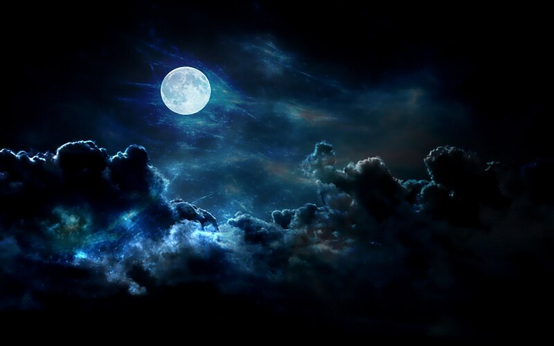 Moonlit night sky with clouds