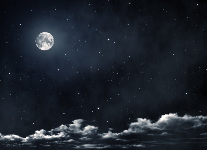 Moonlit night sky with stars