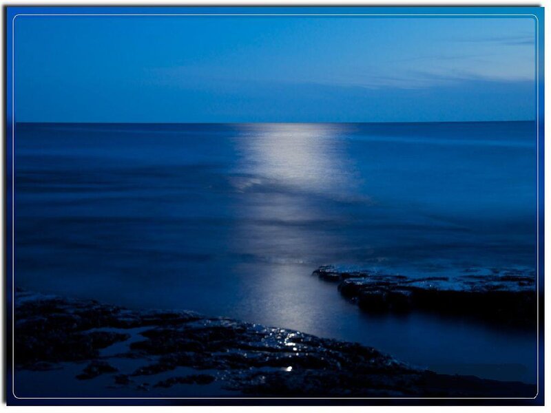 Moonlit ocean at dusk