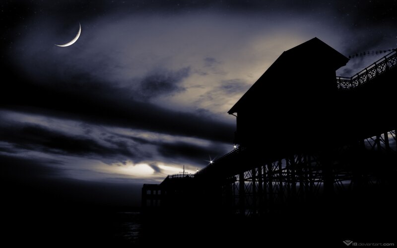Moonlit pier at night