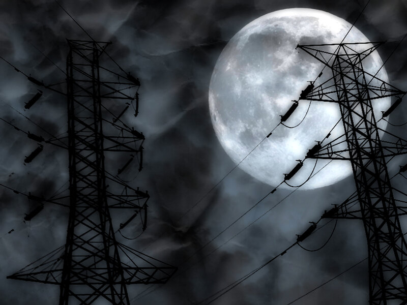 Moonlit power lines at night