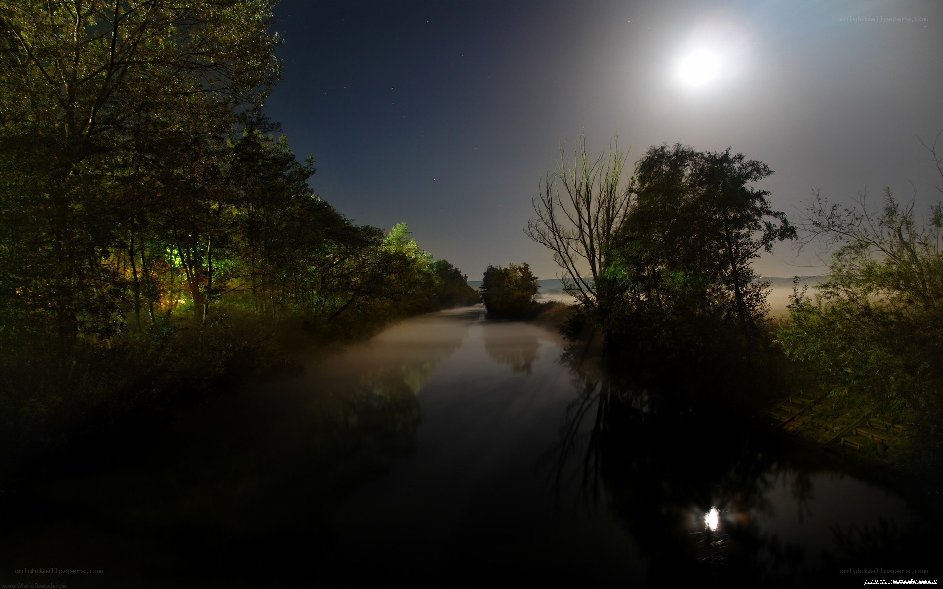 Moonlit river at night