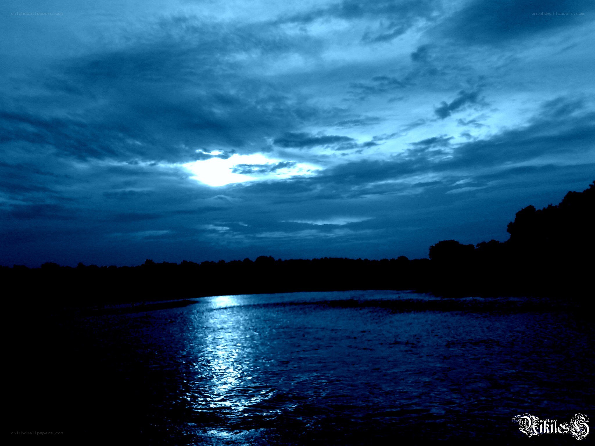 Moonlit river at night