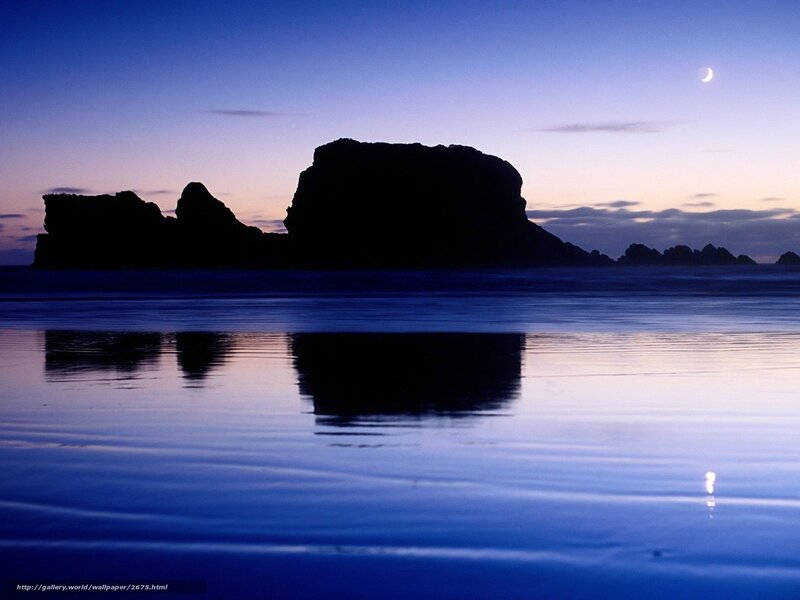 Moonlit rocks at twilight