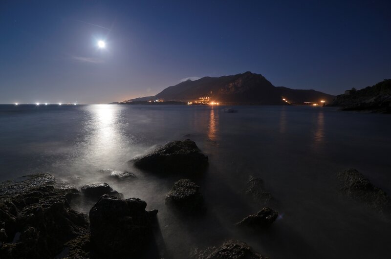 Moonlit Rocky Coastline — Blue, Serene, Night