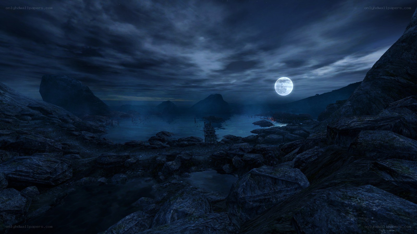 Moonlit rocky lake at night