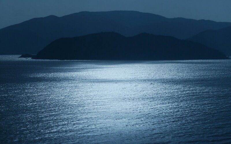 Moonlit sea and mountains