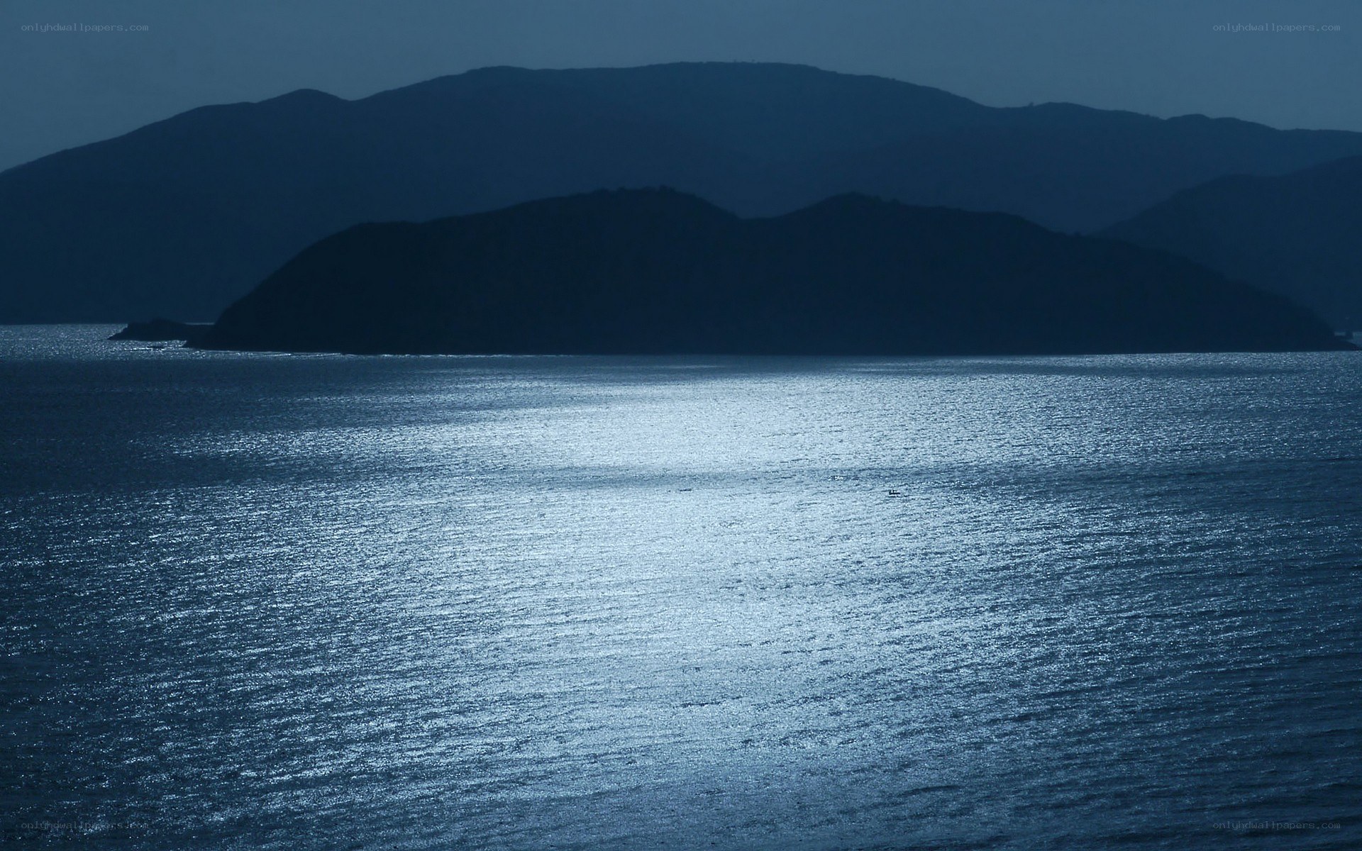 Moonlit sea and mountains
