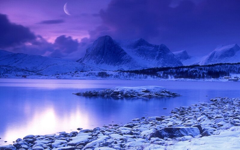 Moonlit snowy mountainscape