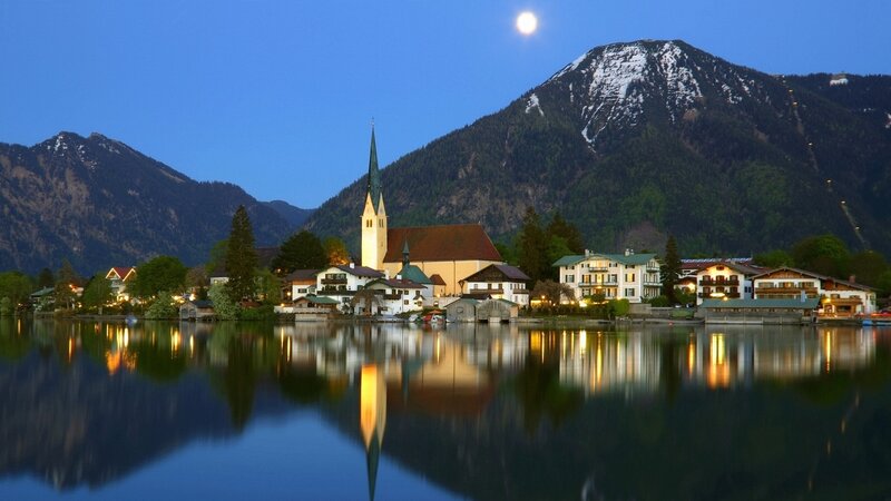 Moonlit village by the lake