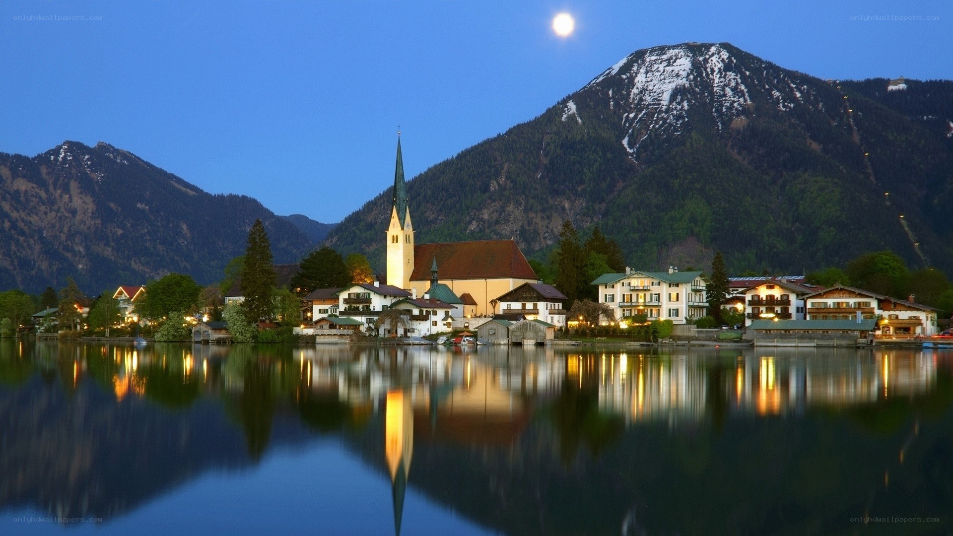 Moonlit village by the lake