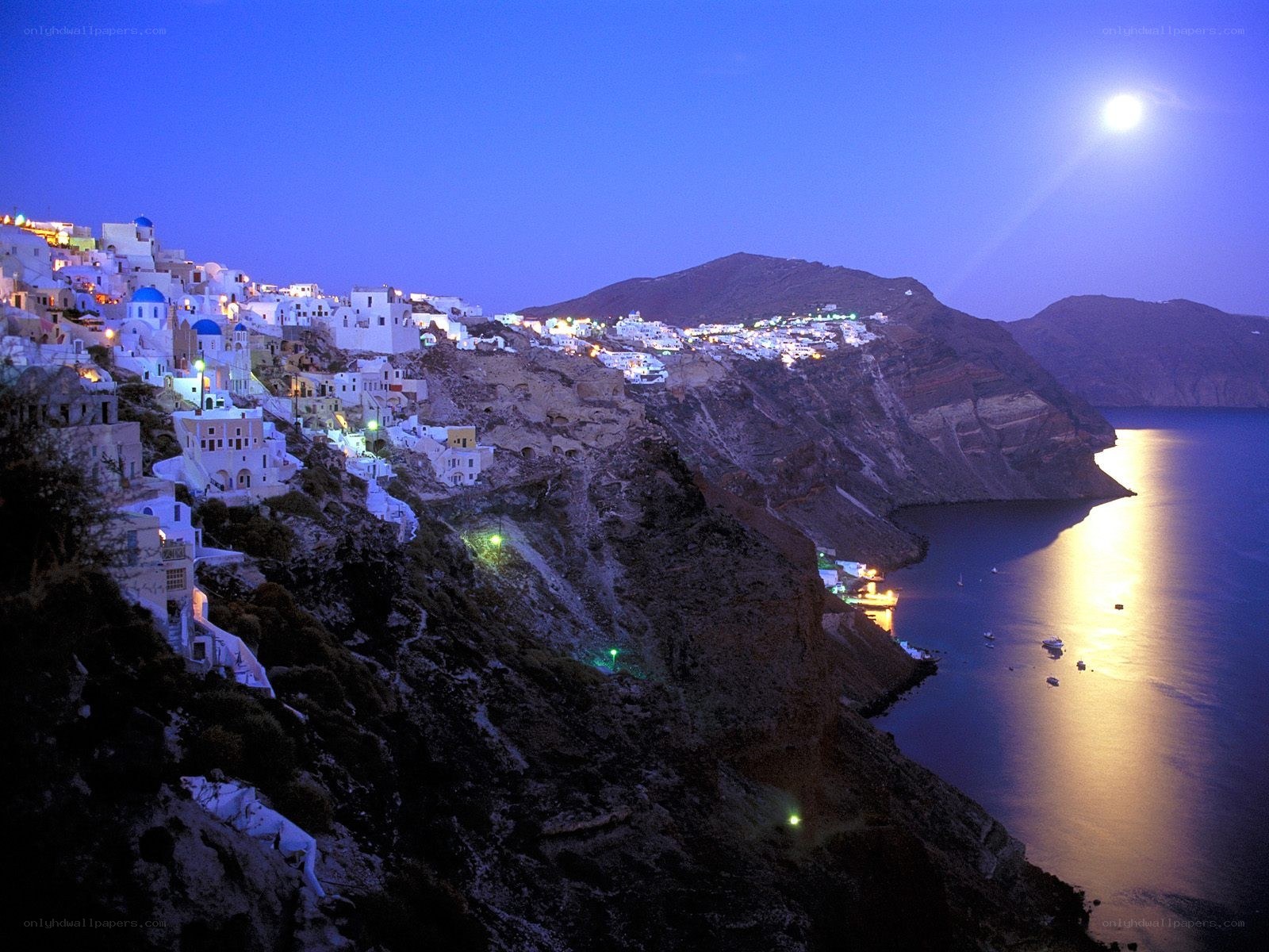 Moonlit village on a cliff