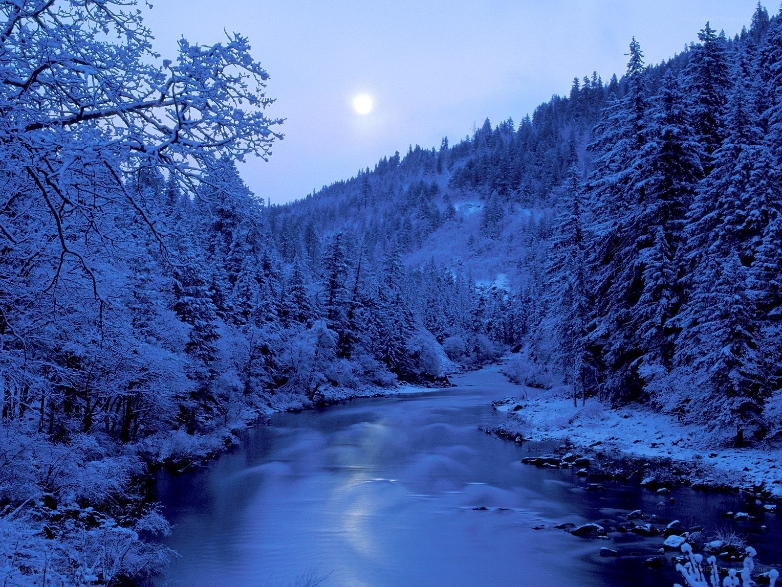 Moonlit winter river scene