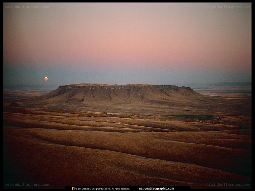 Moonrise over a butte