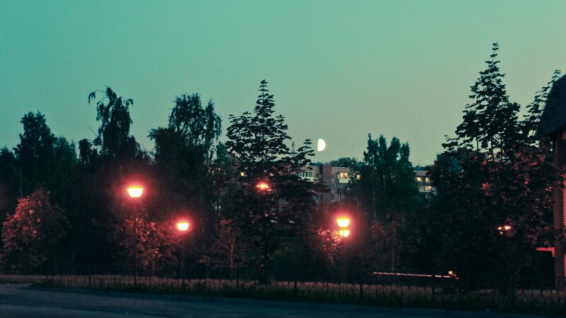 Moonrise over a quiet neighborhood