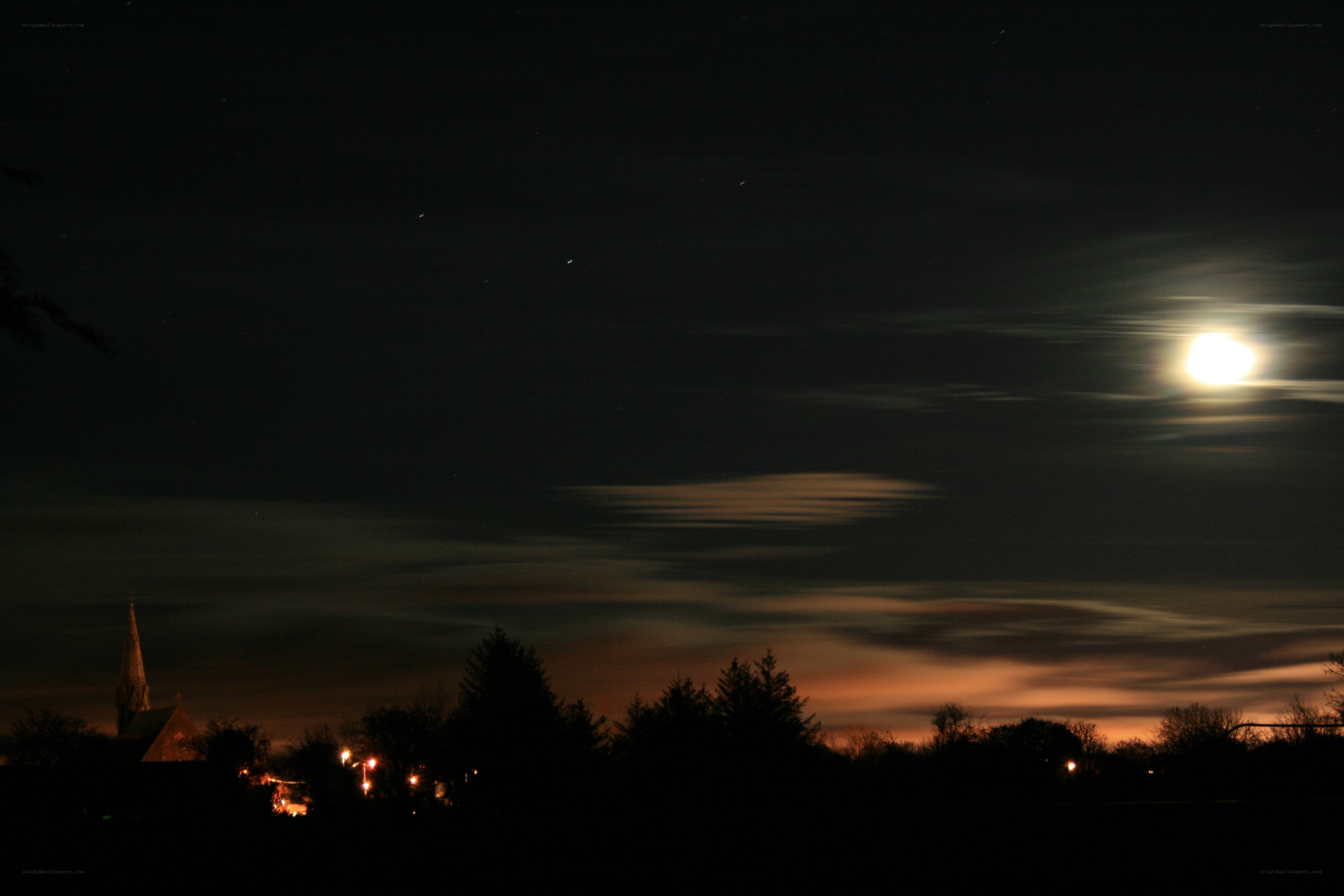 Moonrise over a quiet town